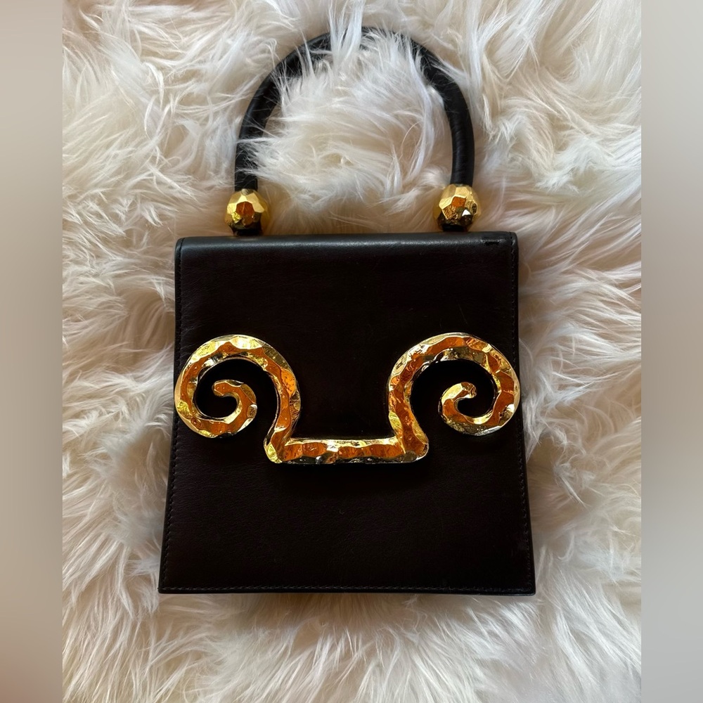 Edouard Rambaud, French luxury. Black leather, gold tone hardware. Clean